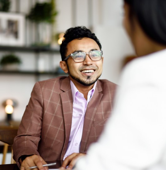 Our employees signing papers at meeting